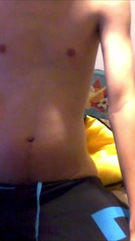 Young Guy Fills His Stomach with Water