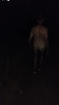 Naked Walking on the Hill Along Highway