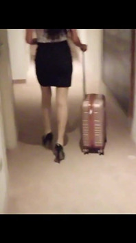 MILF in Stockings and Heels Walks Through the Corridors of a Hotel