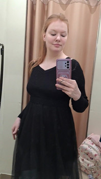 What Words Pop Into Your Head When You Look at the Red-haired Mistress in the Black Dress?