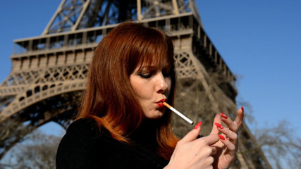 Pink Kitty: Natasha enjoys a cigarete at Eiffel tower