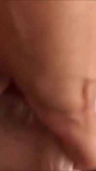 Amateur on the bed at home rubs her hairy pussy