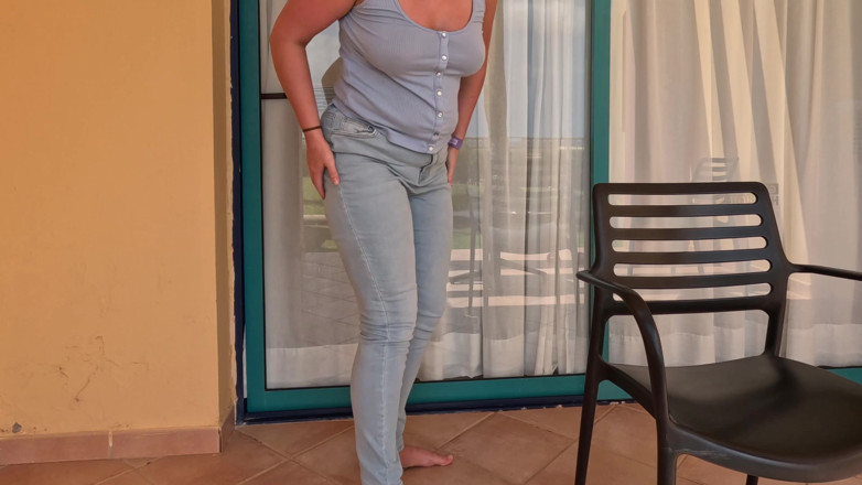 Emma Voyeur: Balcony Full Bladder - Locked and Wetting Jeans