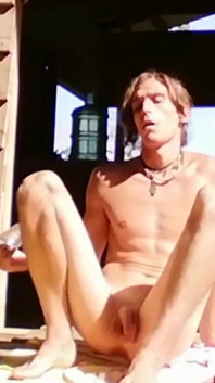 Young gay man opens his ass and sunbathes