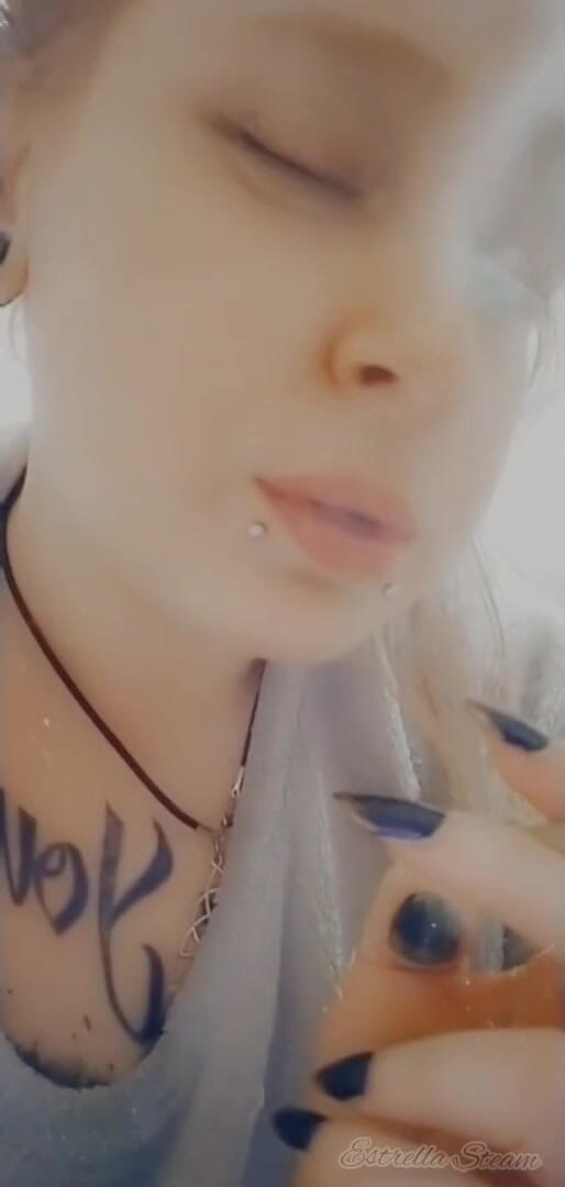 Estrella Steam: Girl with piercings smokes a cigarette