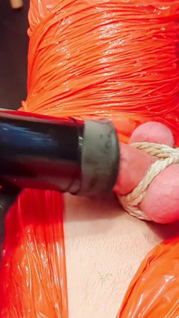 Merciless Cock Milking (tight Shiny Red Plastic Mummificaton and Remote Anal Stimulation)