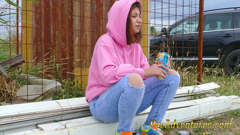 Pee Adventures: Girl with a hoodie pee trough her jeans