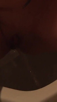 Blonde Babe in Red Lingery Pisses in Toilet and Thereafter Blows a Big Cock and Swallows Cum in the Shower