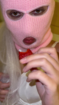 Girl in a Pink Balaclava Sensually Eats Strawberries