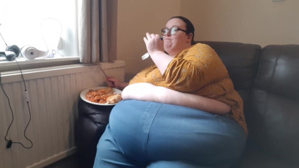 SSBBWLadyBrads: SSBBW huge belly whilst eating on sofa