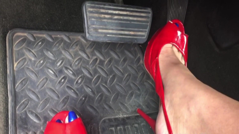 Solo Austria: MILF Megan's pedal pumping in sexy red high heels