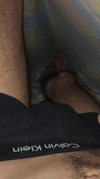 Stroking My Thick Uncut Cock Under the Sheets