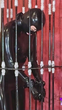 Imprisoned Rubber Slut Has to Give a Blowjob