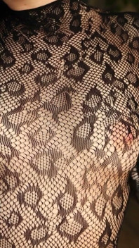 I'm Posing in a Black Fishnet Bodysuit and Heels, Pleasuring Myself with My Fingers.