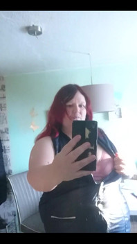 Showing off in a cool lab coat in front of the mirror