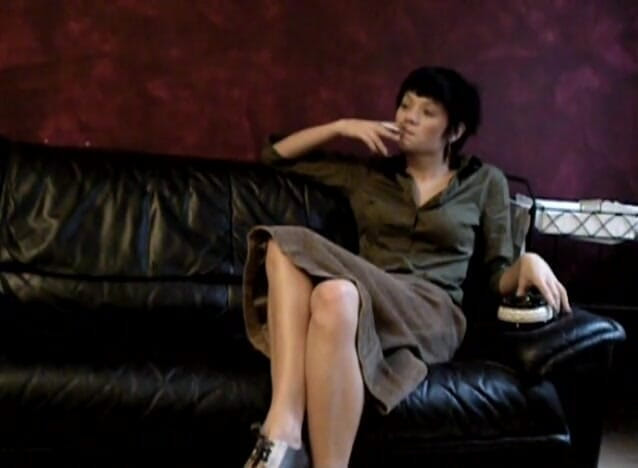 Femdom Austria: Black haired teen smoking a cigarette