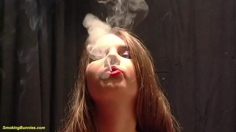 Smoking Bunnies: Cute young big boob teen smoking a cigarette