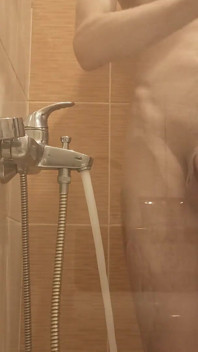 A Young Guy Washes in the Shower and Dreams of Someone Being Next to Him