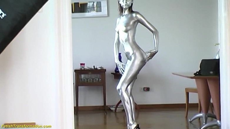 Fetish Islands: Silver metallic painted bald head statue mannequins posing
