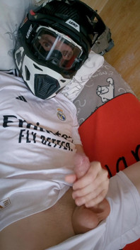 The Guy Is Wearing a Soccer Uniform and Mxhelmet with a Morning Cum