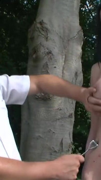 Dominating bondage and wax play in the forest