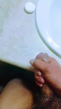 Masturbating