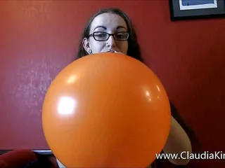 Blowing up and playing with a huge balloon