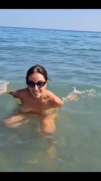 Between and Passers-by, We Try to Relax on the Beach