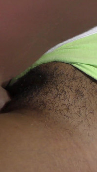 Close-up of a black hairy cunt filled with hot jizz
