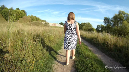 MILF Oxana: Flashing and naughty fun at the riverside