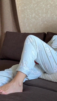Farting in Pajamas on a Pillow While Sitting on the Couch