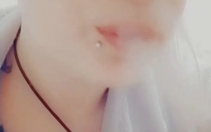 Estrella Steam: Girl with piercings smokes a cigarette
