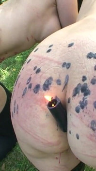Humiliated wax play threesome in the forest