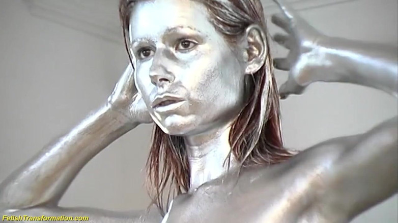 Fetish Islands: Silver metallic painted bald head statue mannequins posing