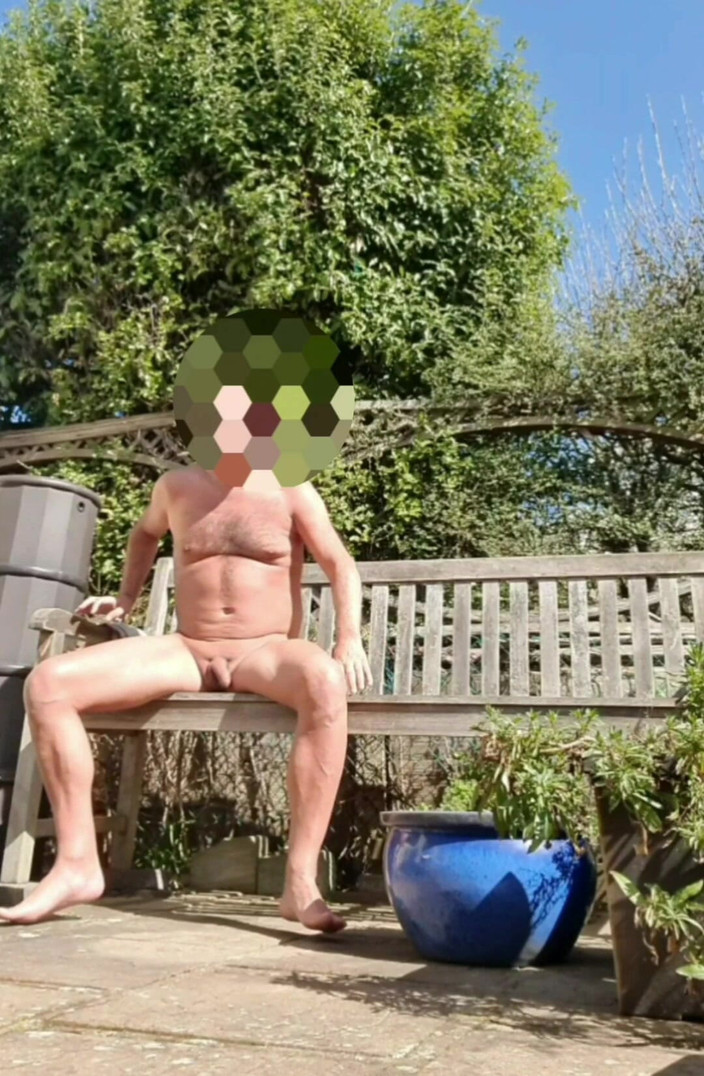Male Model: Enjoying the Sun in a Garden