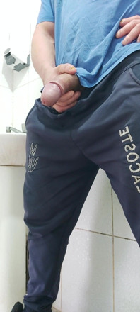 A Well-endowed Brazilian Man Urinating and Showing His Thick Penis to His Female Friends.