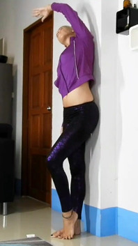 Sensual Wall Stretching in Shiny Purple Leggings