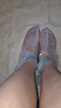 Pedicure Step Feet in Plastic Foot Mask Booties