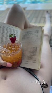 Reading by the Pool in a Bikini That Barely Counts as Spf