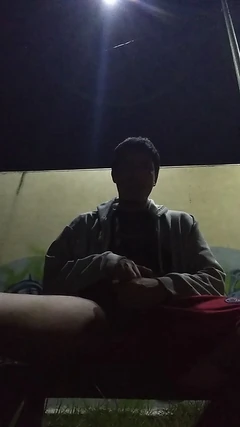 No Warm Shirt Man in Park with Only Sweater on Feeling Warm