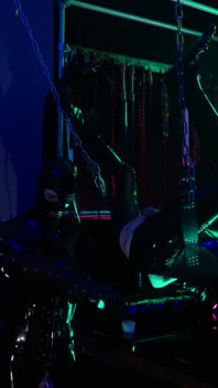 The rubber Domme the giant dildo and the gimp