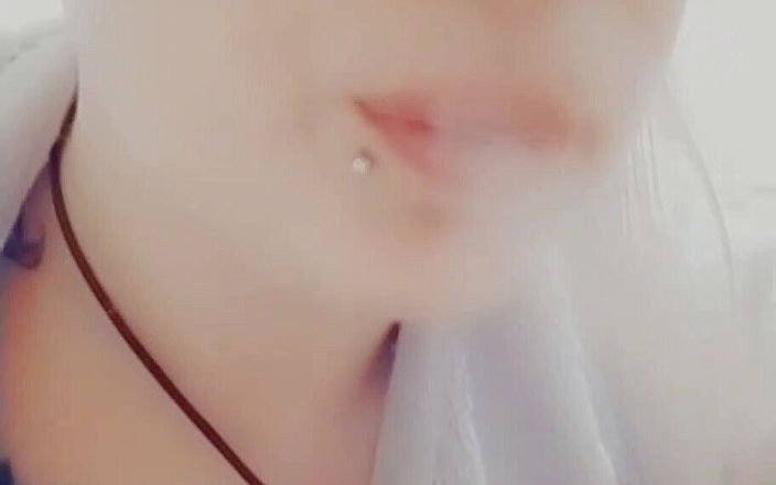 EstrellaSteam: Girl with piercings smokes a cigarette