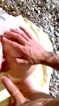 A brunette with big tits gives Kevin White anal sex and a deep blowjob on the beach.