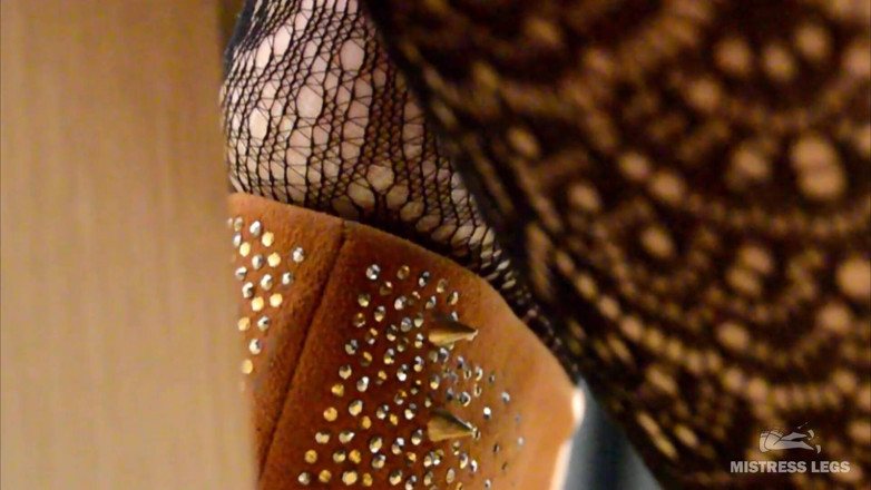 Mistress Legs: My lazy dangling shoe on the feet in black fishnets