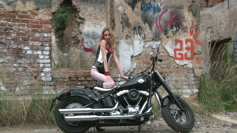 Public Entertainment: Skinny blonde on a bike
