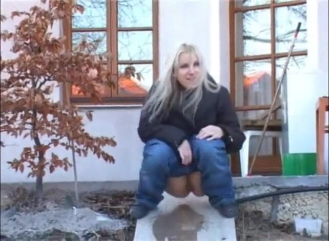 Femdom Austria: Slut pisses next to a house