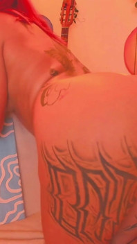 A Latina with a Tattooed Body Is Shaking Her Butt for You