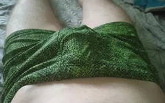A Guy in Beautiful Green Swimming Trunks Jerks off His Soft Cock with His Fingers
