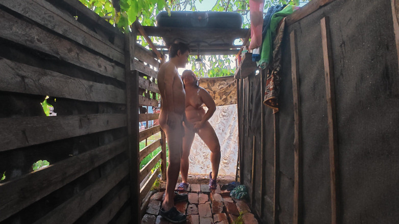 SchoolPrincess: Large Tits Couple Outdoor Shower Oral Sex
