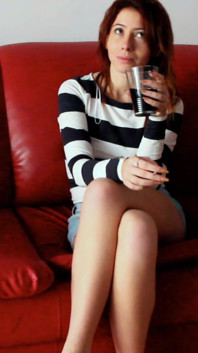 Skinny Redhead Smoking on a Couch